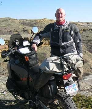 Blaster Bill with his motorcycle in the South Dakota badlands